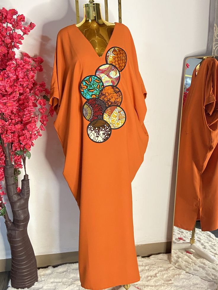 Orange kaftan with Ankara appliques — studio piece